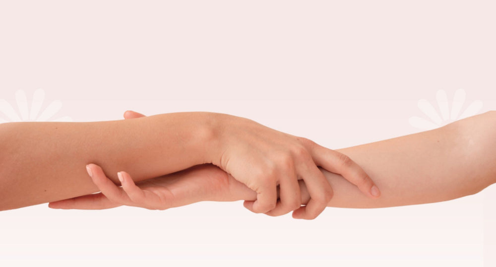 Two hands holding each other, a symbol of partnership