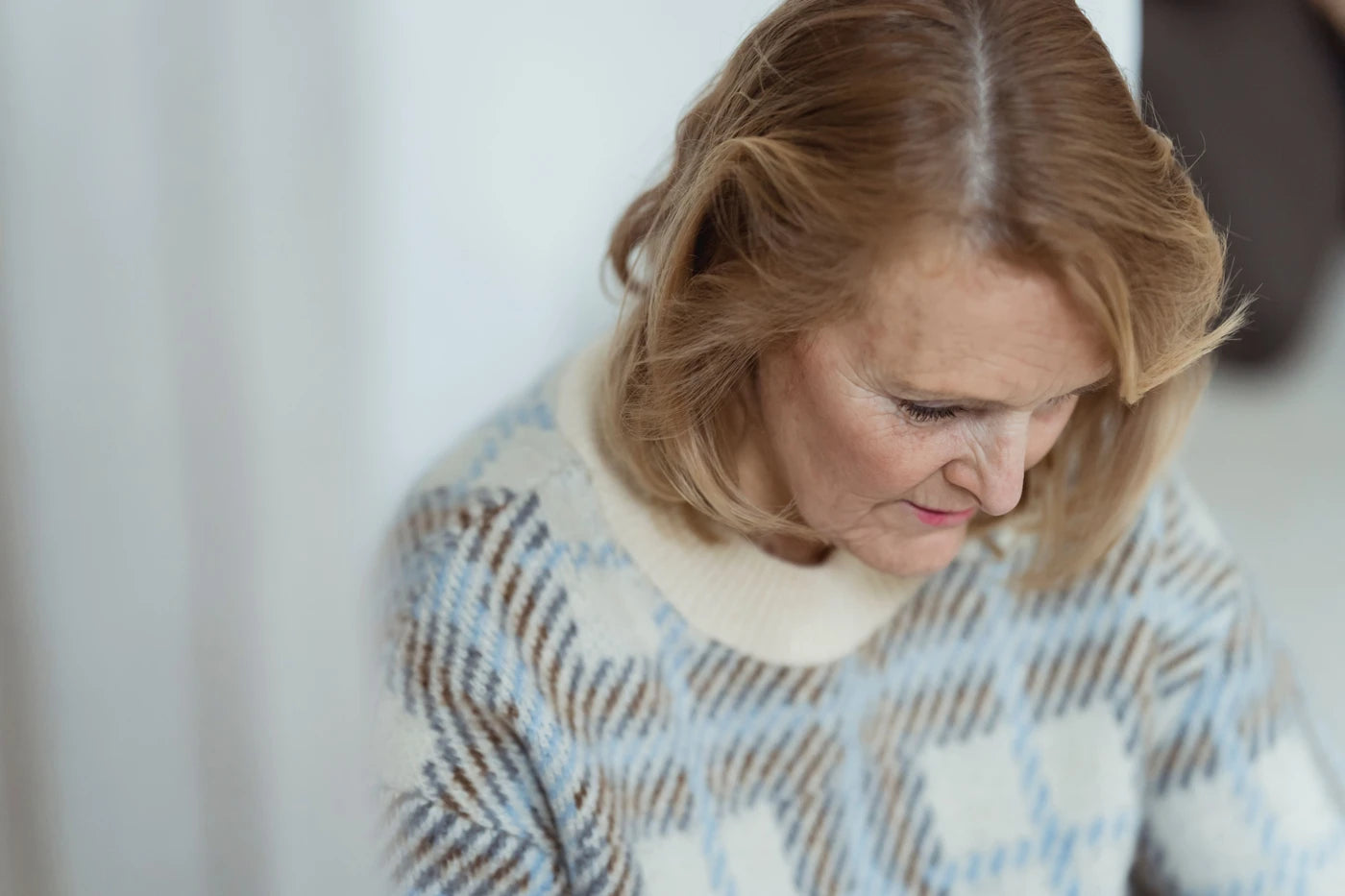 Mature woman in a quiet moment at home in natural light