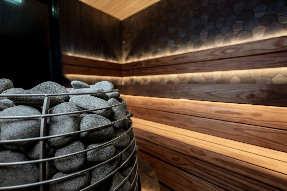 Wooden sauna with heated stones